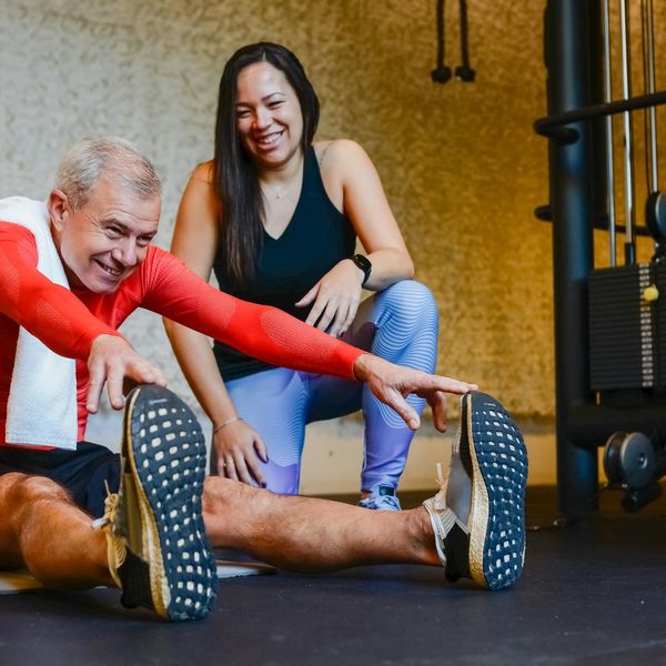 Person smiling and stretching, feeling energetic and well.